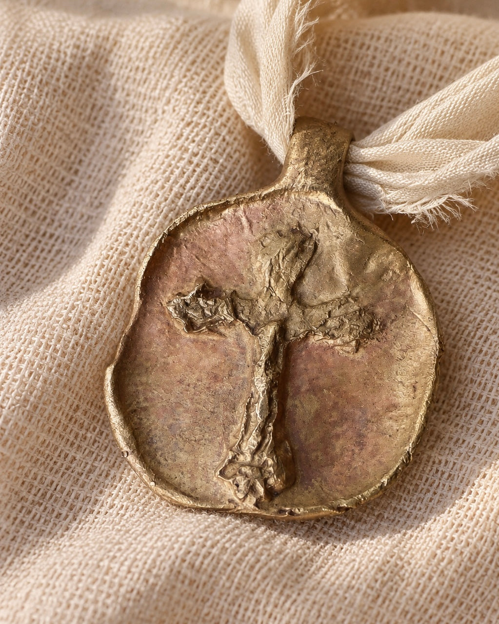 Embossed Cross Pendant - gold-colored brass