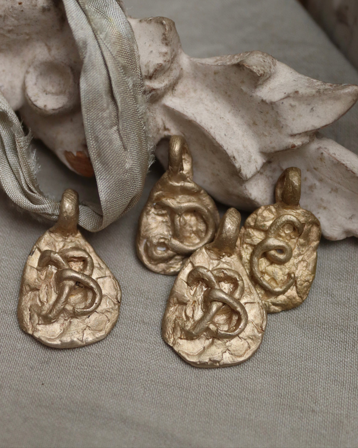 Medal with an Initial - gold-colored brass