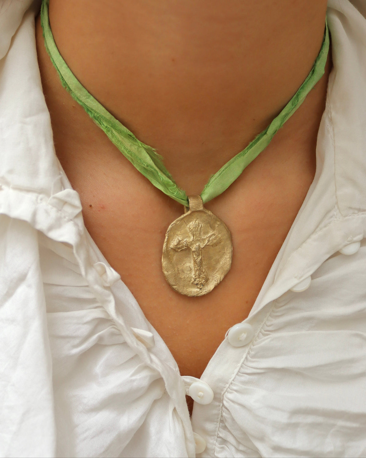 Embossed Cross Pendant - gold-colored brass