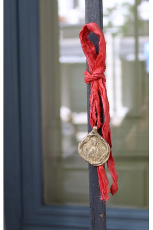 Medalla rústica de  San Fermín en latón. Hecha artesanalmente por Sandra Bellew.