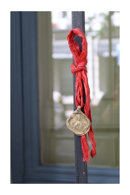 Medalla rústica de  San Fermín en latón. Hecha artesanalmente por Sandra Bellew.