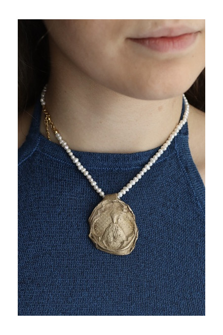 Medalla rústica de  San Fermín en latón. Hecha artesanalmente por Sandra Bellew.