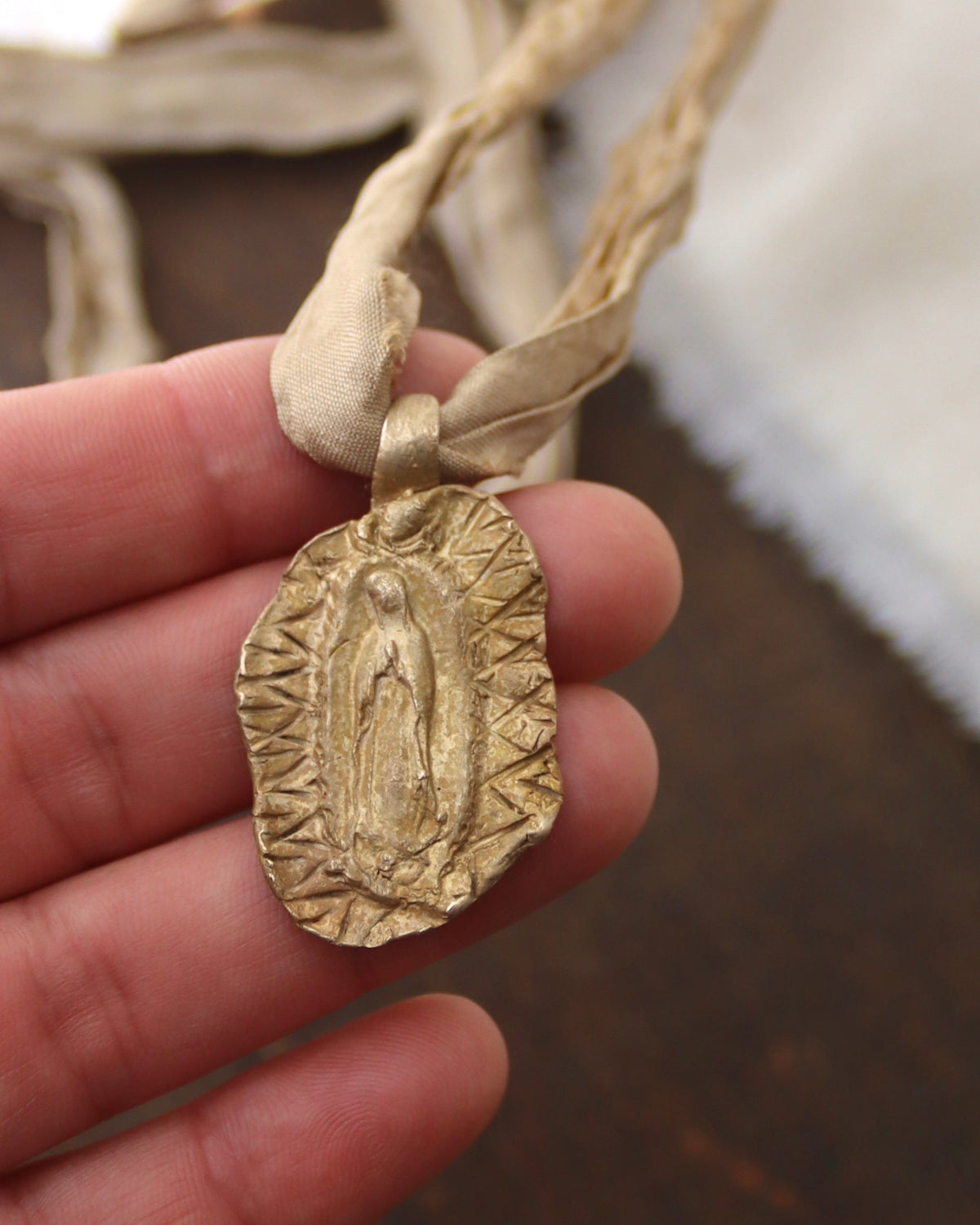 Our Lady of Guadalupe Pendant - gold-colored brass